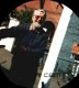 Dad, leaning on a car