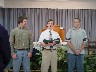 Darin, Danny, and Darren serving the Lord's Supper at church