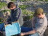 Silas and Andrew building a raft after they lost their kites