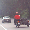 guy on a motorcycle with a sidecar