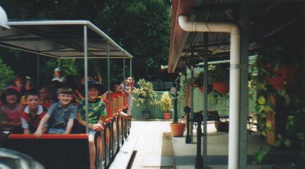 Families enjoying the tractor train tour at Crystal Creek Miniatures