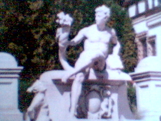 statue in front of castle