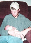 New dad , Chris , holding his son, Chris. heh