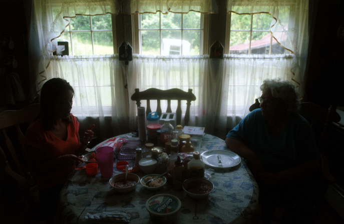 Grandma and Grand-daughter at the Kitchen Table.