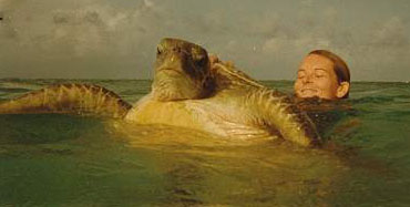 This is my sister Rae, doing unspeakable things to a turtle!