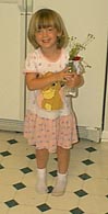 Katie with her freshly picked weeds.