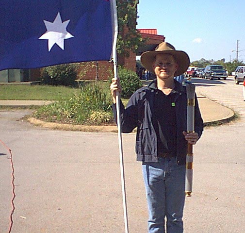 Darryl holding the Australian flag and one of the actual torches from the Atlanta 1996 Olympics!