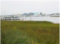 The view from the bend at Arlie Road.  The last building in the distance with a white roof is the Bluewater Grill which was the location of the beauty contest in Season 1