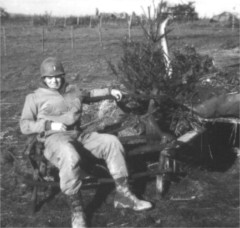 Officer in front of dug-out (bunker)