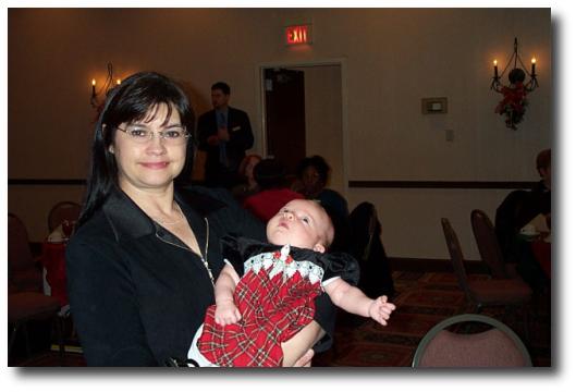 Director Laurie
	      Lapeyrouse holds the newest addition to our D&D family, "Ellie", daughter of member Lisa Ingraham..