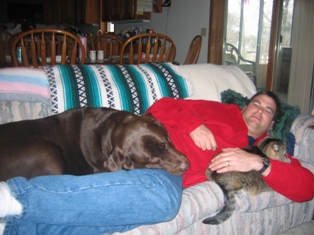 Laying on the couch with Chip and Stripes.