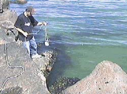 Lowering the transducer into the water ...  (Ian Hynes)