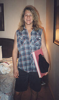 Jesse holding a scrapbook from Stacey Walker