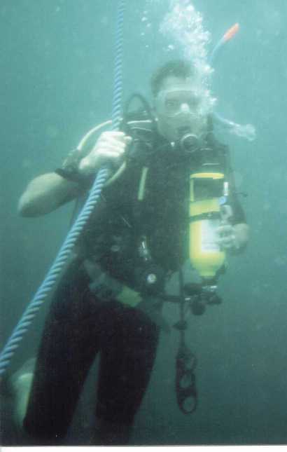 Sean practices emergency decompression on the anchor line, with a pony bottle as a redundant air source.