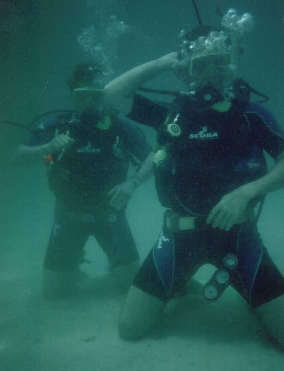 Chris and Andy, Open Water course Martini Bay. Chris is signalling or possibly trying out his new dance routine for Thursday night.