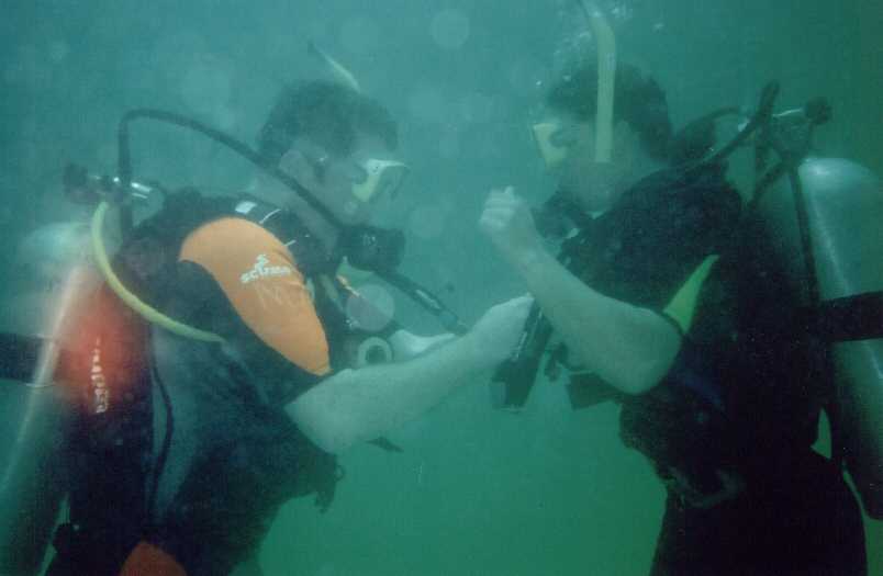Chris and Andy practice using a buddy's alternate air source in an out-of-air situation.