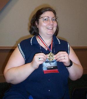Lori holding Haiku Contest Medallion
