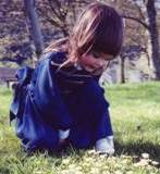 Hannah posing in a hill of flowers