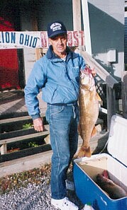 Captain Bob Hanmer and his 14 1/2 pound walleye that was caught oct.17 this year, it was 33 1/2 inches long.