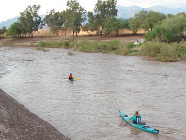 Photo credit: Angela Paige Putman. Kayakers on the Santa Cruz, near the St. Mary's bridge