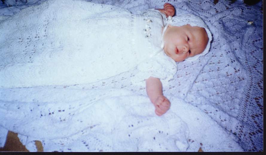 Frances in the Christening gown her Grandmother made for her