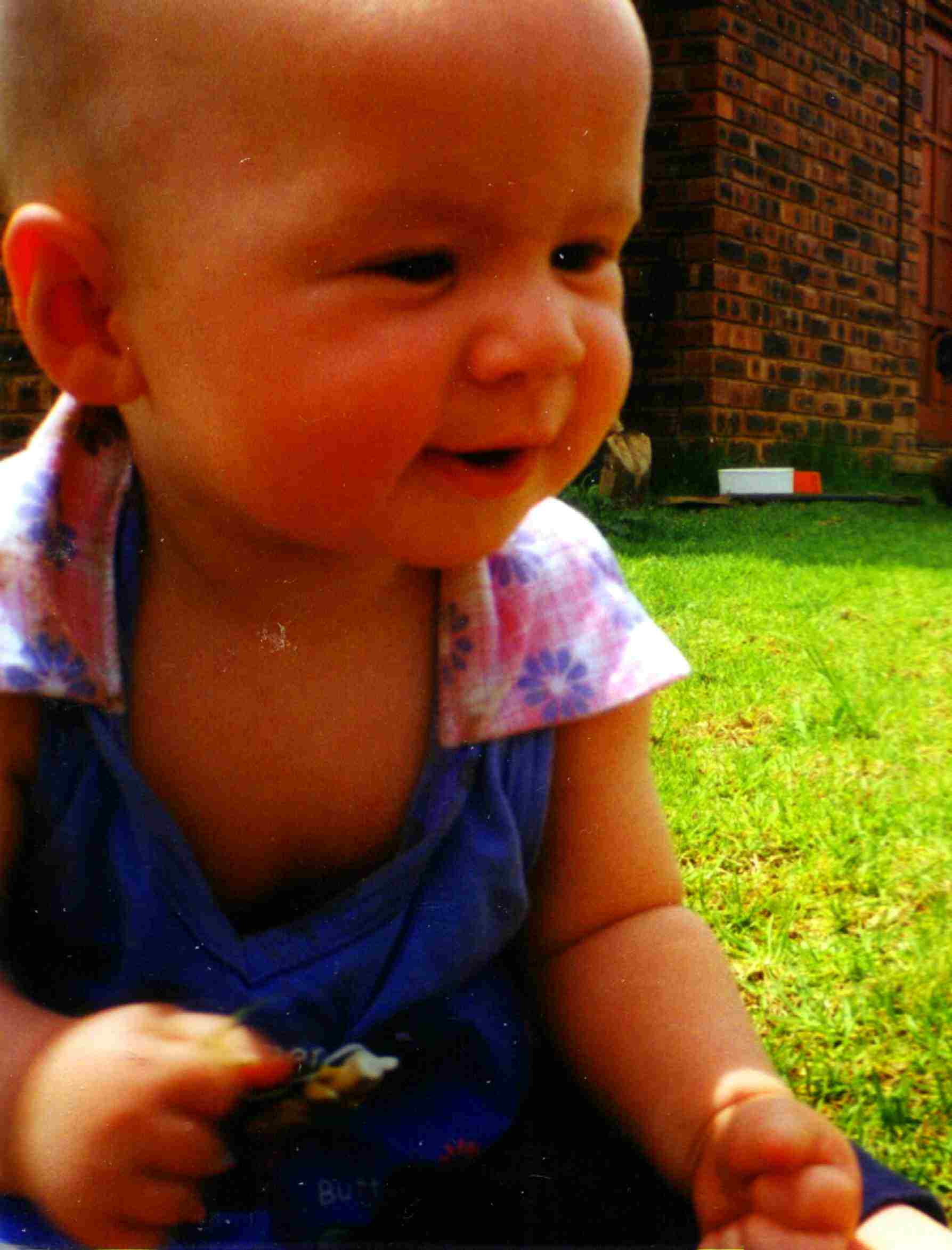 Frances Sitting on a Sunny lawn