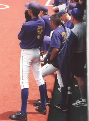 The team watching the batter, Arny cheering 
