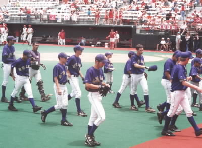 The team walking back to the dugout.