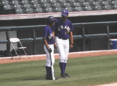 Coach Craft talking to CJ before he bats.