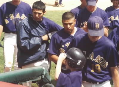 Meliton after his HOME RUN!!! The guys going back into the dugout.