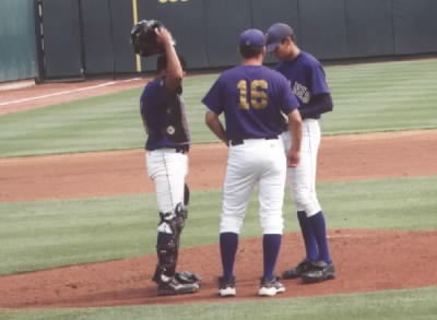 Coach Craft talking to Marcus and Arnold on the mound.