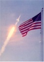 waving US flag & rocket iftoff
