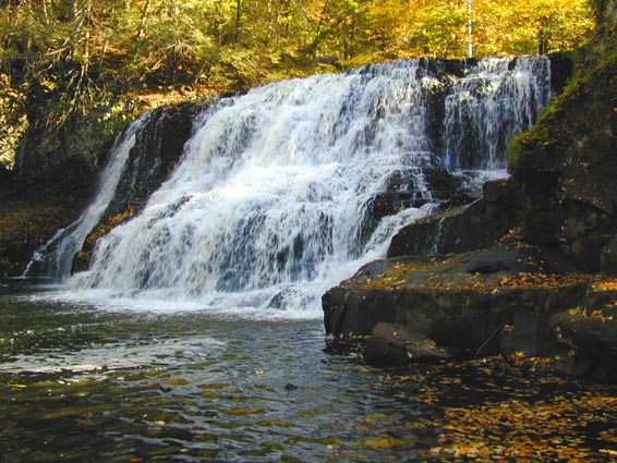 The Big Falls at Wadsworth Falls St Park in the fall with multicolored leaves.
