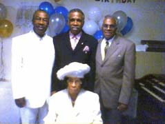Missionary Jeffereys with her son Wiley Cooke on left, Bishop C.E. Cooke in the middle and her nephew Clarence Mitchell on the right.