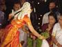 Prasee putting thulsi garland