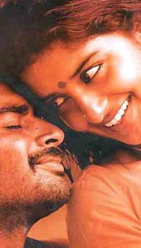 R Madhavan and Meera Jasmine in AAYITHA EZHUTHU.