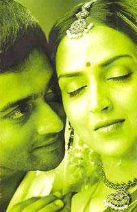 Surya and Esha Deol in AAYITHA EZHUTHU.