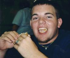 Chris eating something...maybe a mustard sandwich?