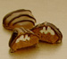 Our dipped pecan-topped dark fondant Dresse Noix.