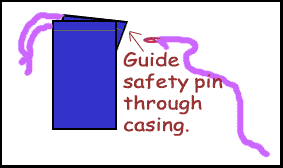guide safety pin through casing