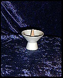 cone incense held in sake cup
