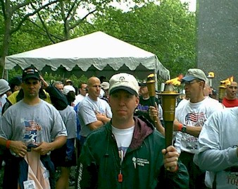 Doug with Lit Torch in Law Enforcement Torch Run NYC - Thanks Lt for Photo