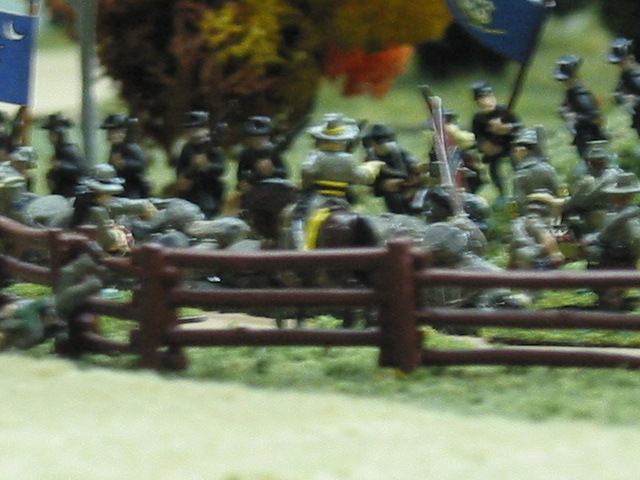 One regement make it to the stone wall and estabilshes a position. The Confederates form line in the road and engage them at close range.