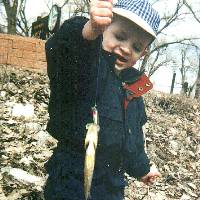 Another view of Michael's 1st fish April 02, 2001