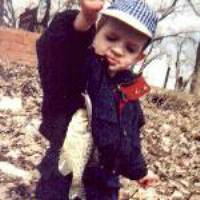 Michael fishing on April, 2 2001 at age 2 1/3 years, showing off his first ever fish!