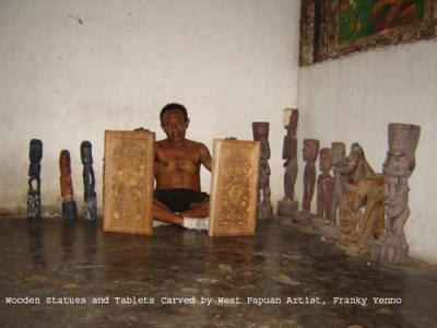 Wooden statues and tablets carved by West Papuan artist, Franky Yenno. Photo shot by Charles Roring