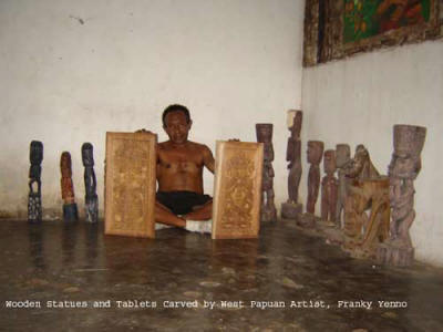 Wooden statues and tablets carved by West Papuan artist, Franky Yenno. Photo shot by Charles Roring