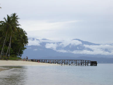A harbour in Mansinam island with Arfak Mountains at the background. The photo was shot by Charles Roring in 2006