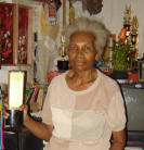 Ester Kereway (62) holding a trophy is one of the West Papuan artists who is still creating various kinds of artworks in her old age.