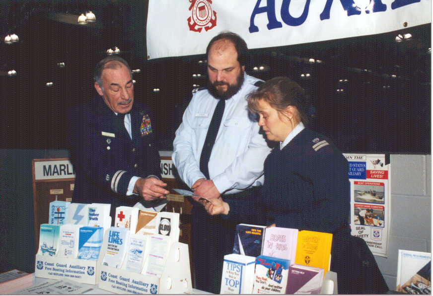 Photo of flotilla members working at a boat show